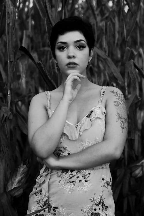 Grayscale Photo of a Woman with Short Hair Wearing Floral Dress
