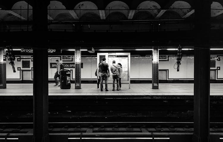 Unrecognizable People Standing On Metro Station Platform