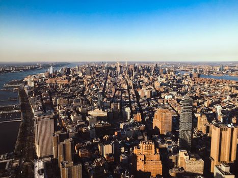 Stunning aerial view of the New York City skyline with clear blue skies.