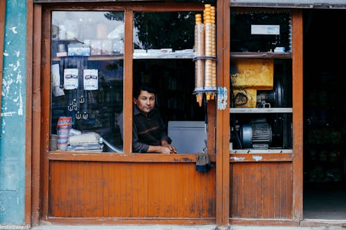 Photo Of Man Through A Window