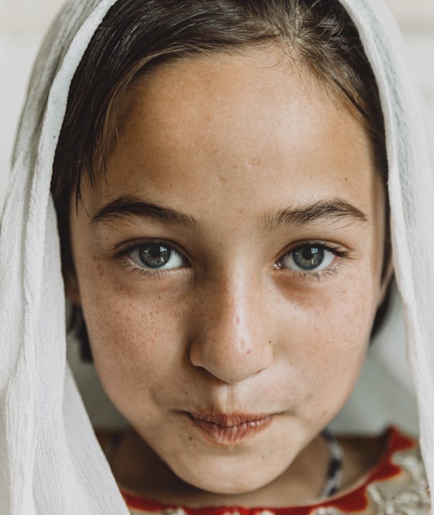 Close-Up Photo of Girl Wearing White Headscarf