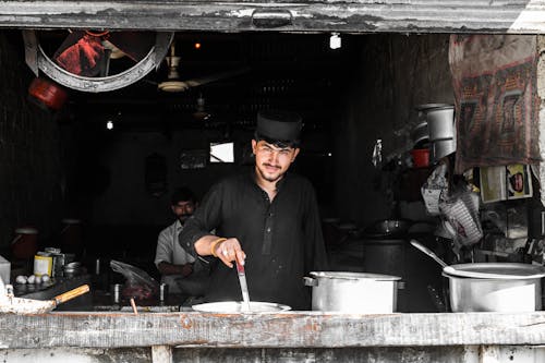 Man Cooks at the Diner