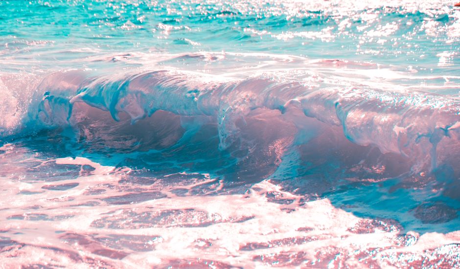 A stunning ocean wave with vivid color effects, capturing the essence of a lively seascape.