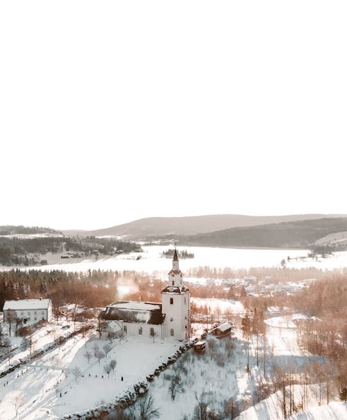 Church in the Village by the Frozen Lake