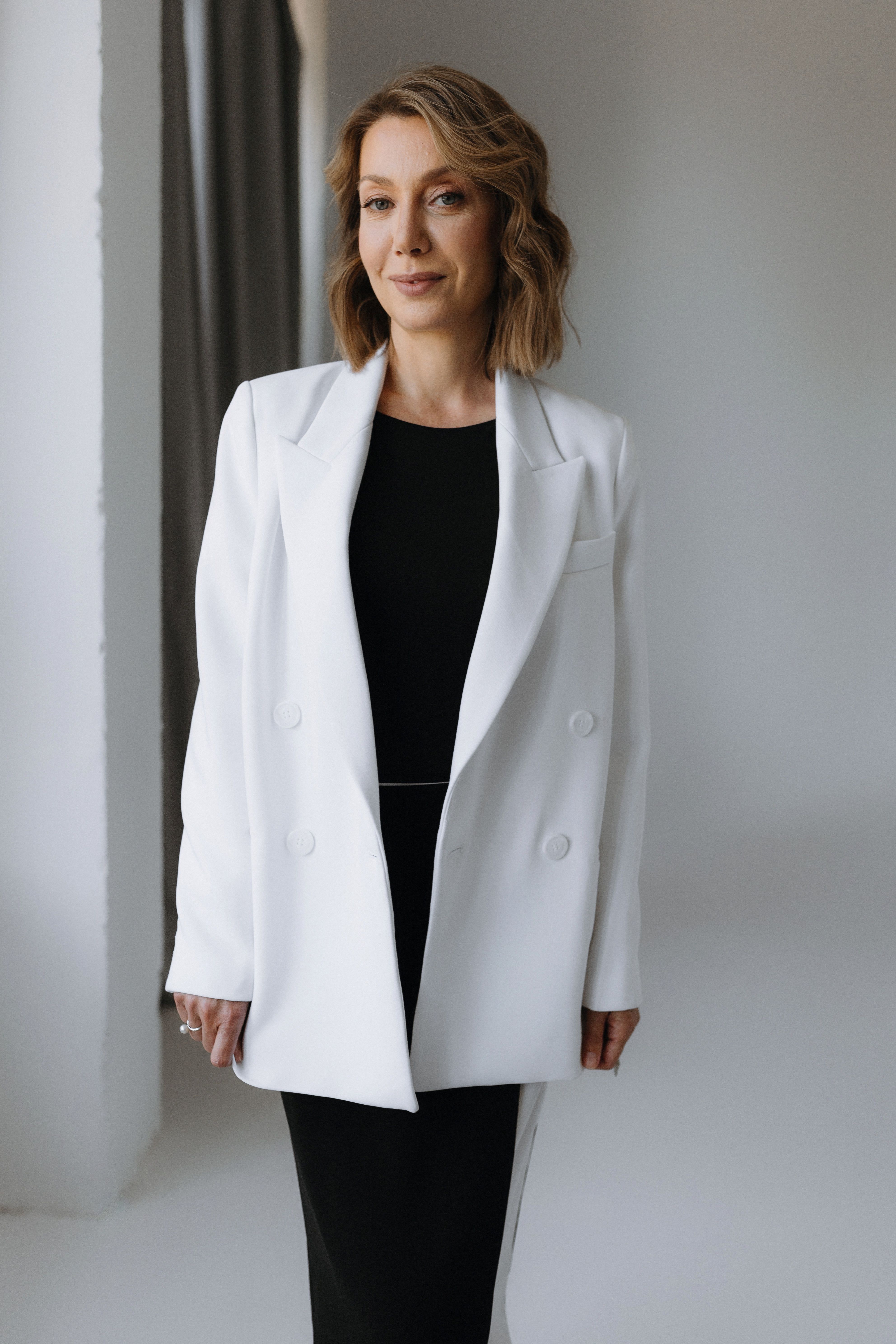Woman in White Suit · Free Stock Photo