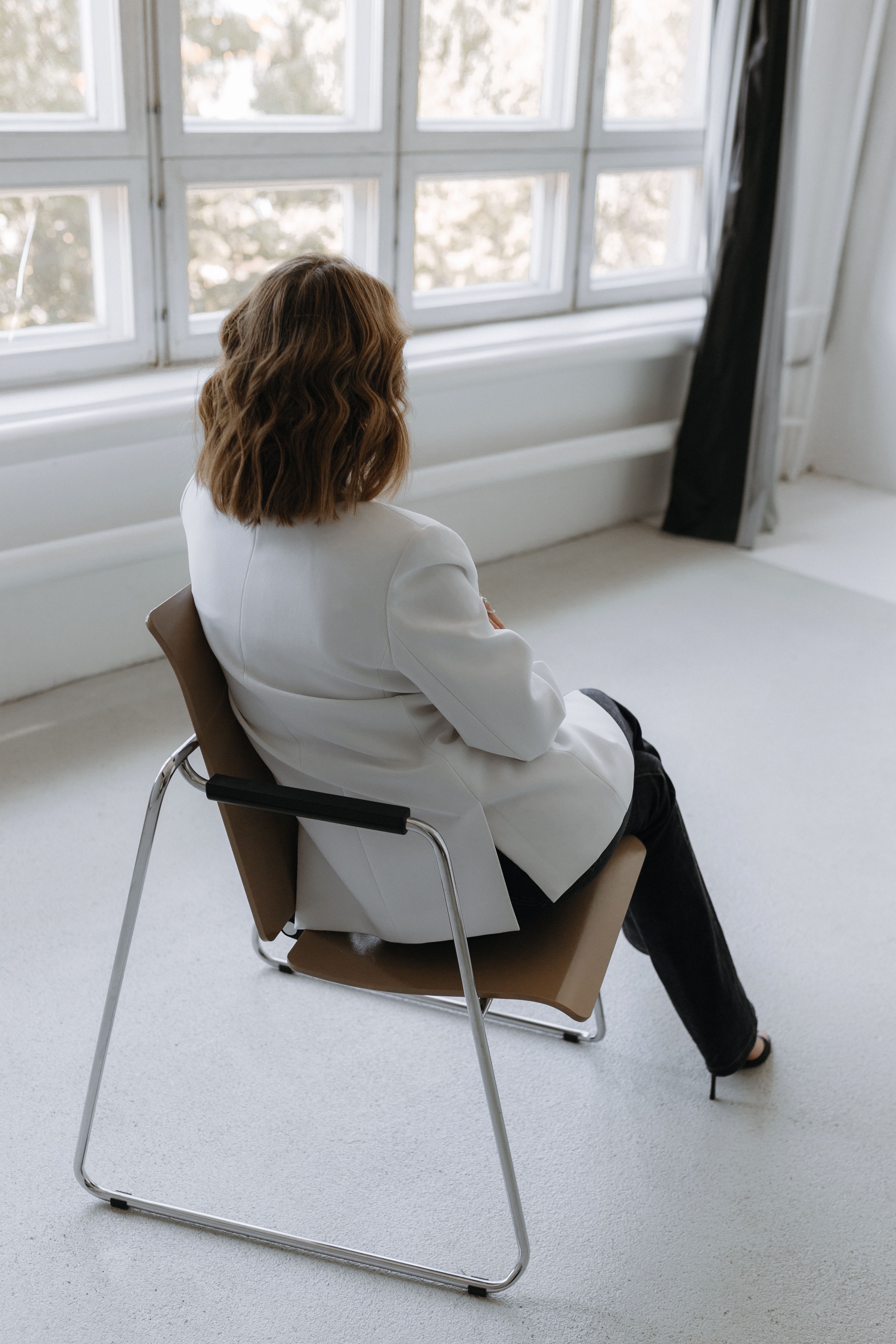 Back View of Woman Sitting on Chair · Free Stock Photo