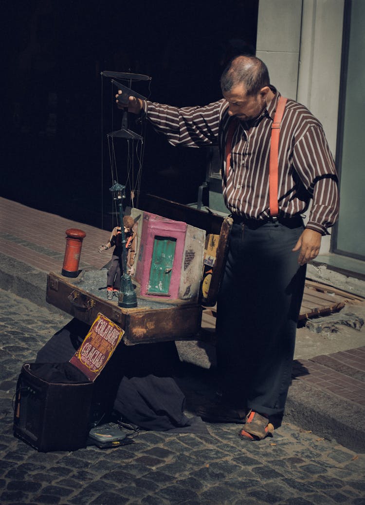 Puppeteer Playing With Puppets On Street