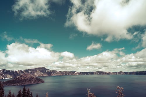 Photo of Mountains Under Cloudy Sky