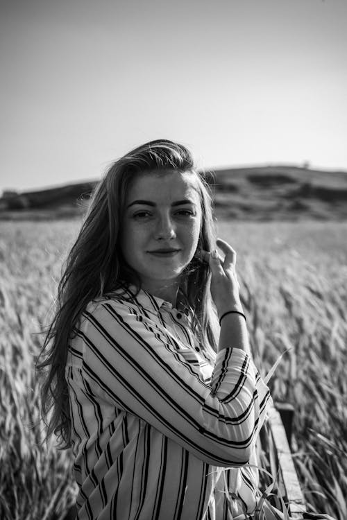 Monochrome Photography of a Woman in a Wheat Field