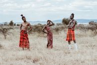 Photo of Three People Wearing Red Tribal Clothes