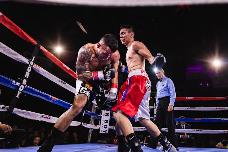 Low-Angle Photo Of Two Men Fighting In Boxing Ring