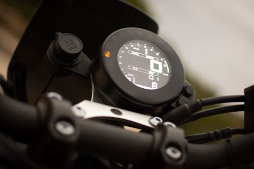 Close-Up Photo of Motorcycle's Speedometer