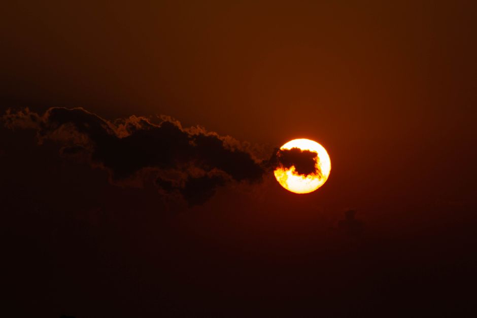 Capture of the vibrant sunset with dramatic clouds in Aaqrabâte, Syria.