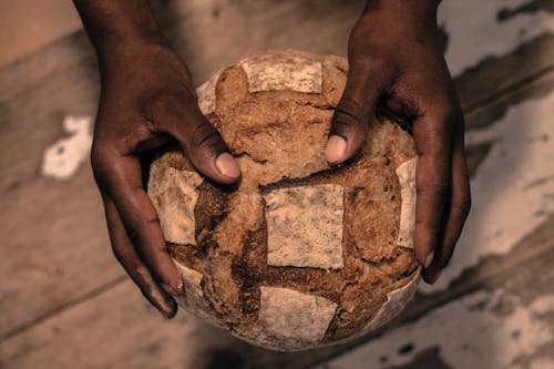 Free Person Holding A Bread Stock Photo