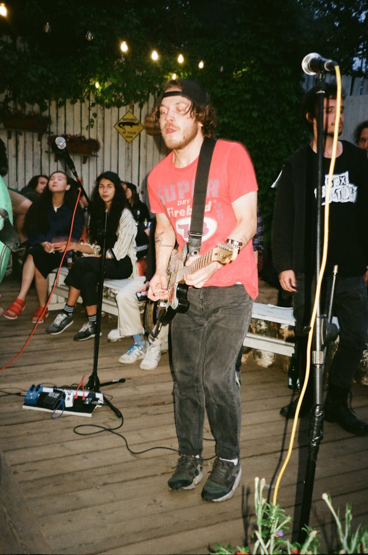 Photo Of A Man Playing Guitar