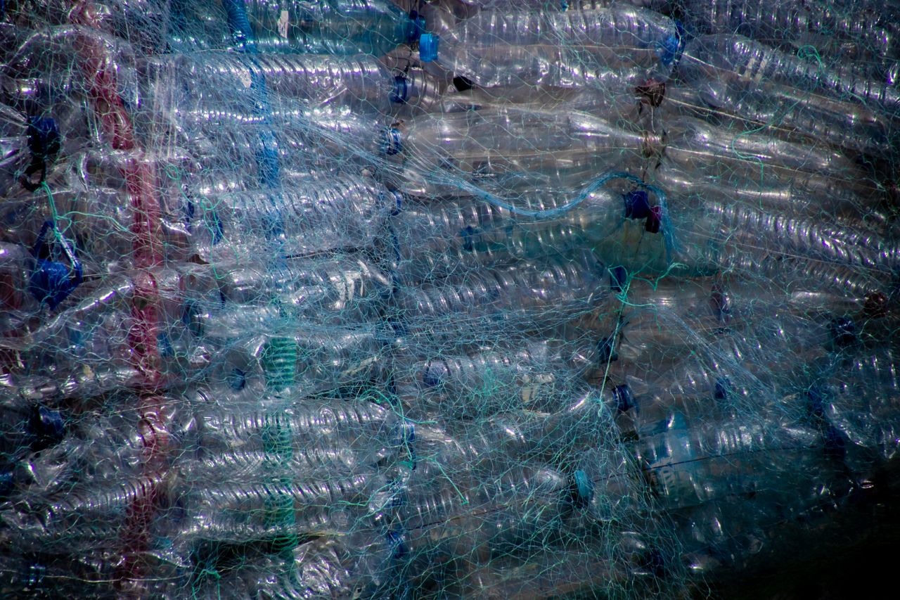 Plastic bottles wrapped for recycling.