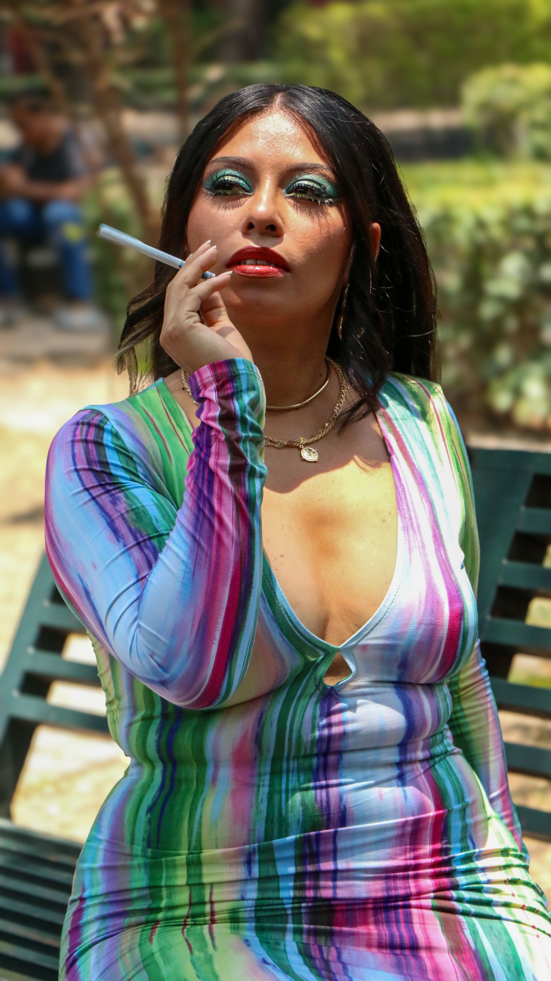 Woman Wearing Colorful Dress Smoking a Cigarette  Free Stock Photo