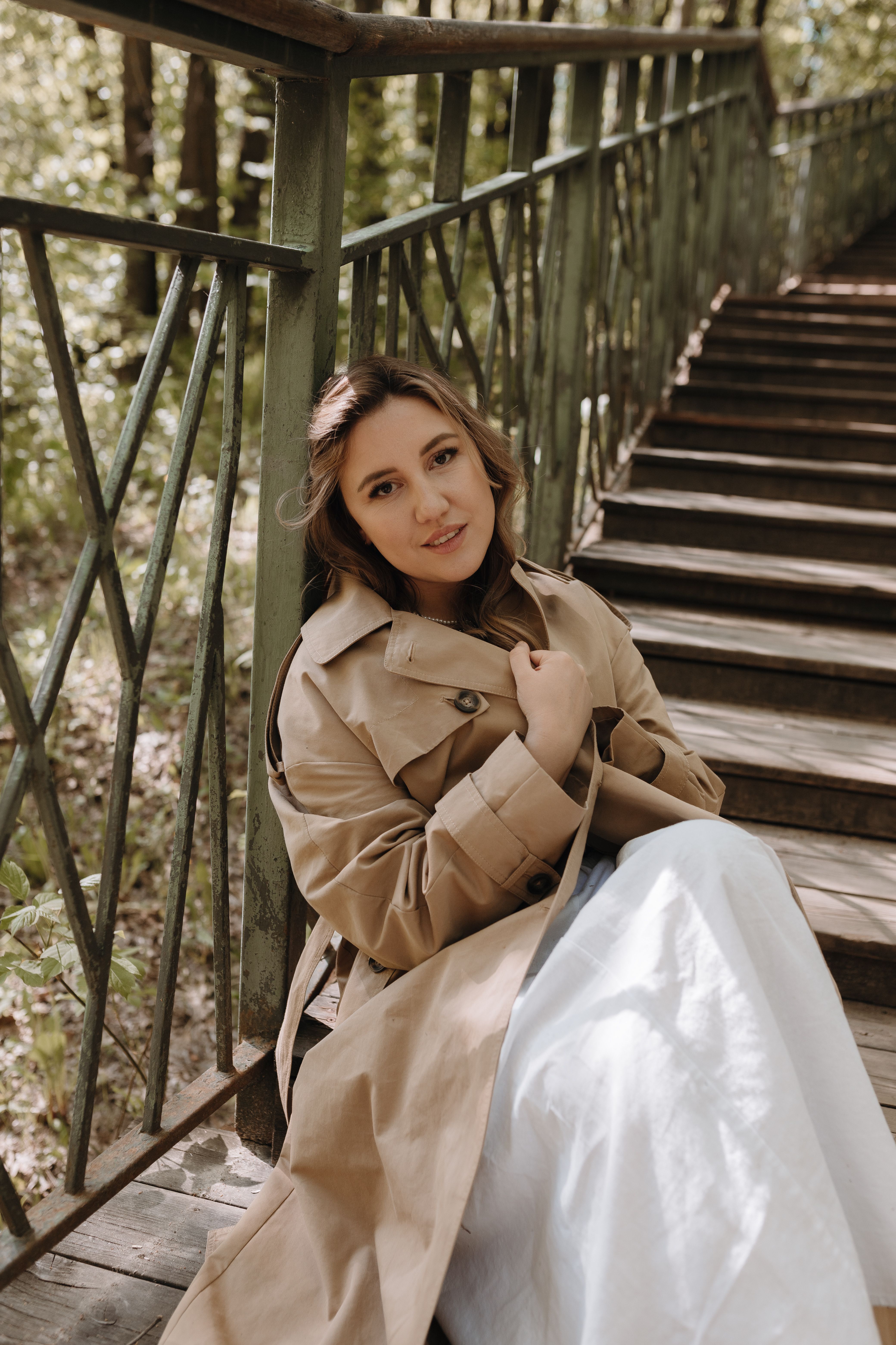 Woman posing in a trench coat