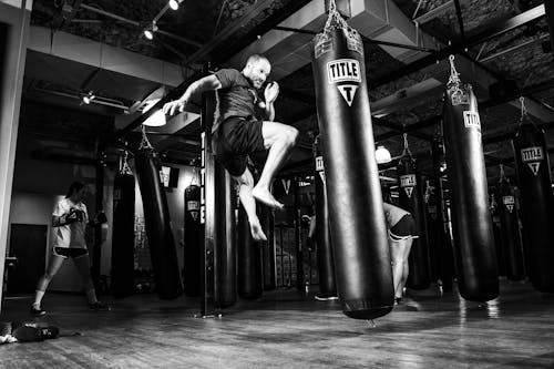 Man Kicking Heavy Bag