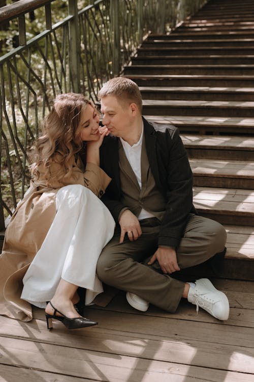 A couple sitting on the stairs together