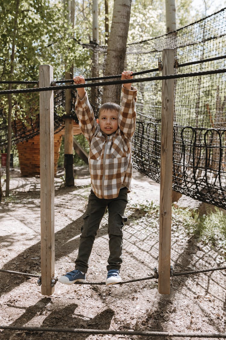 A Little Boy Playing In The Park