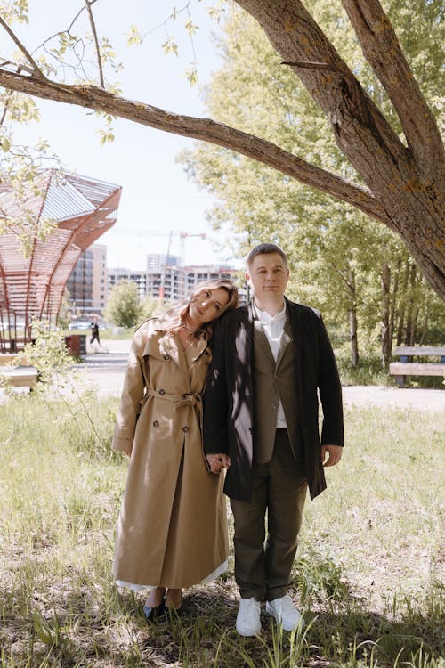 A couple standing in front of a tree