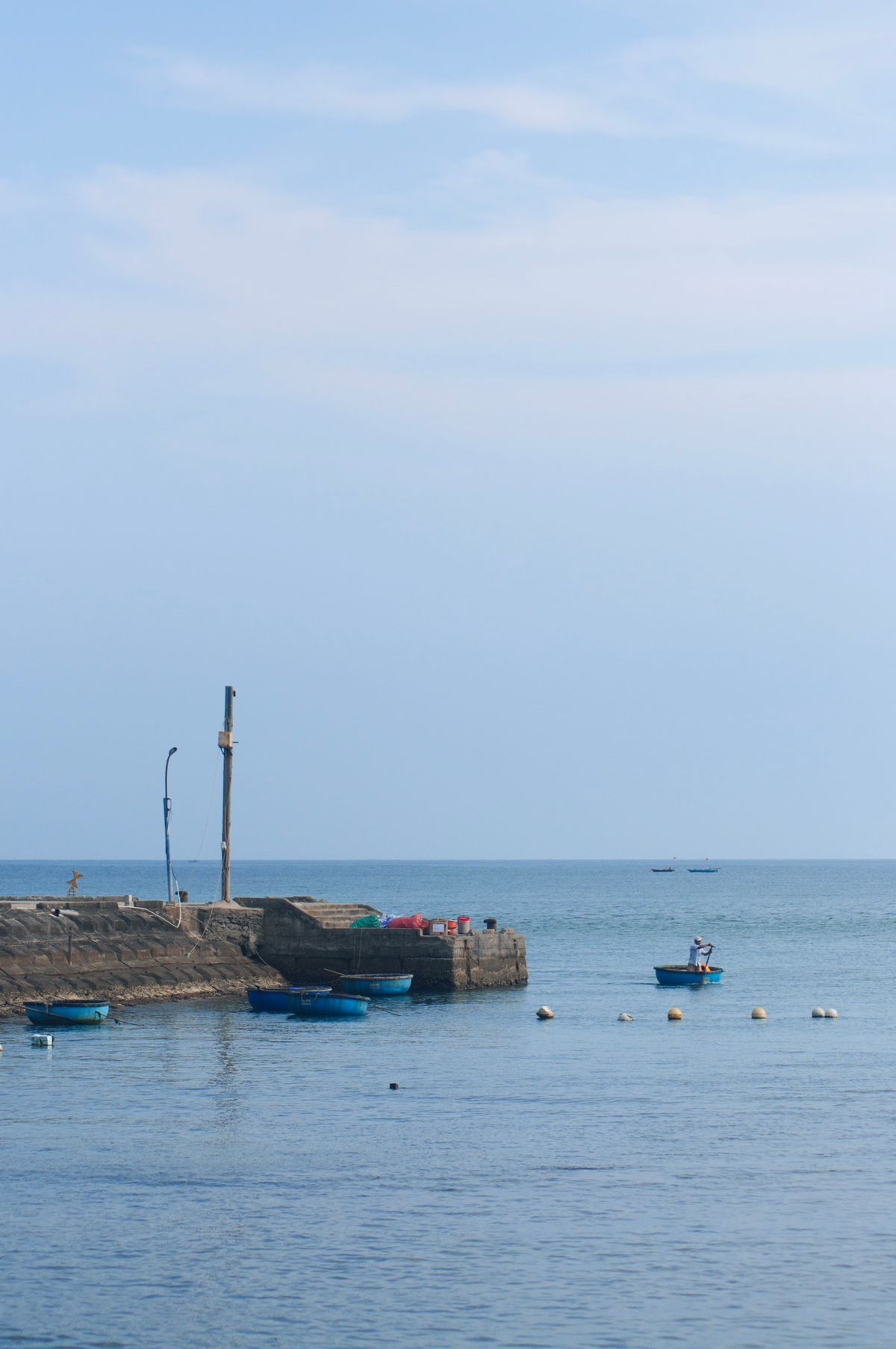 Peaceful Japanese fishing village harbour with traditional boats