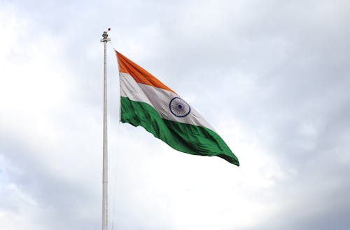 An indian flag flying in the wind