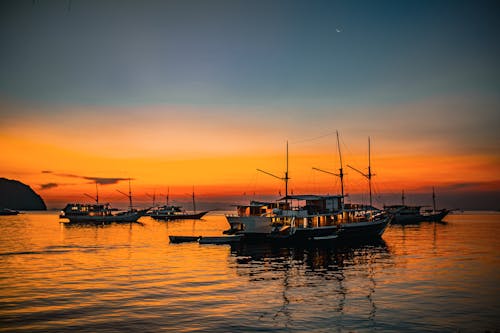 Sunset view with boats on the beach