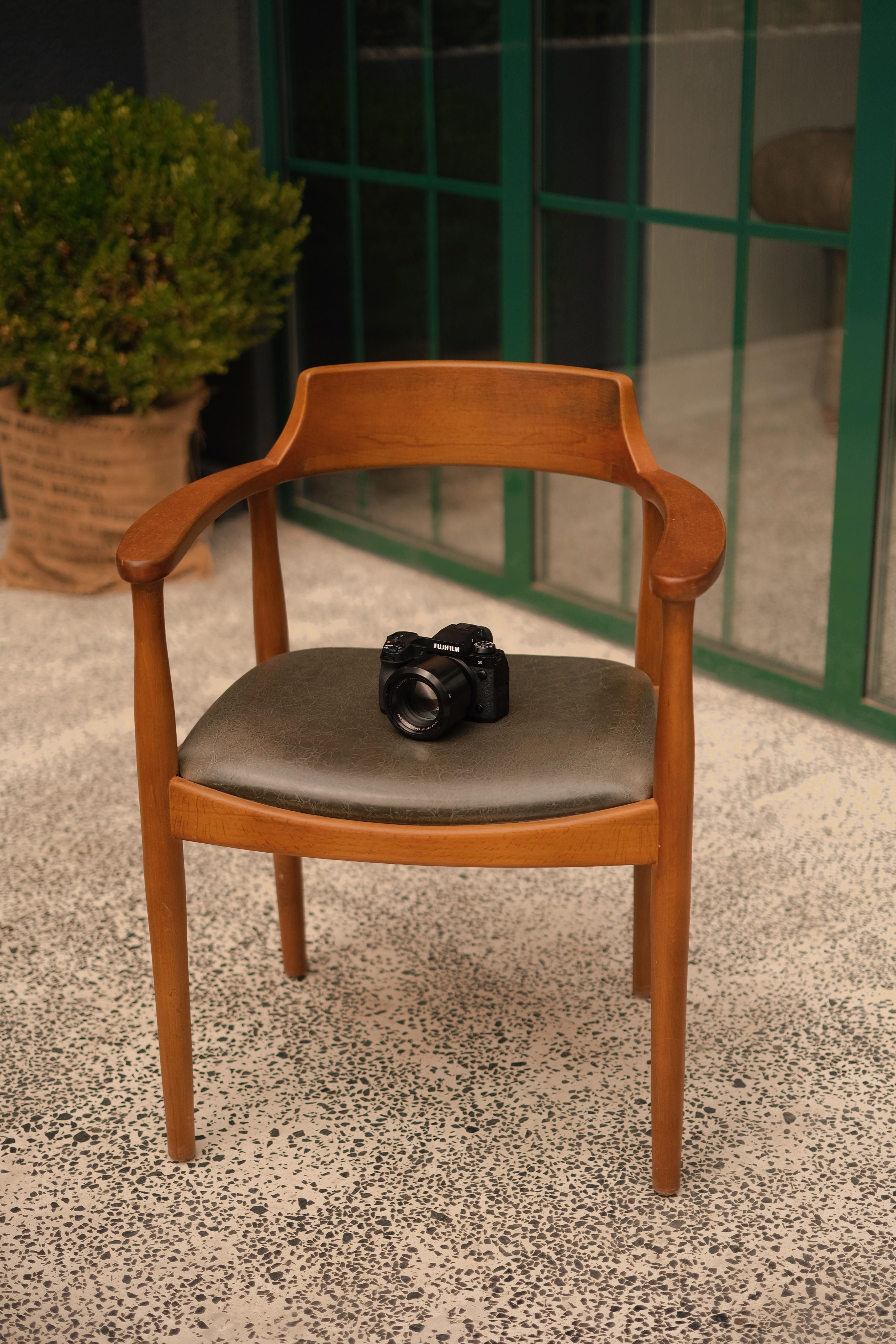 A Camera Lying on a Chair · Free Stock Photo