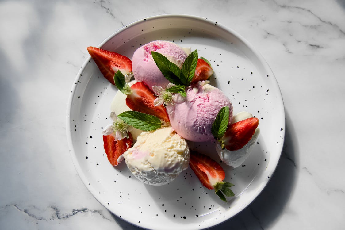 Free Top View of Scoops of Strawberry and Vanilla Ice Cream Stock Photo