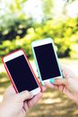 Selective Focus Photography  of Two Smartphones With Blank Screens