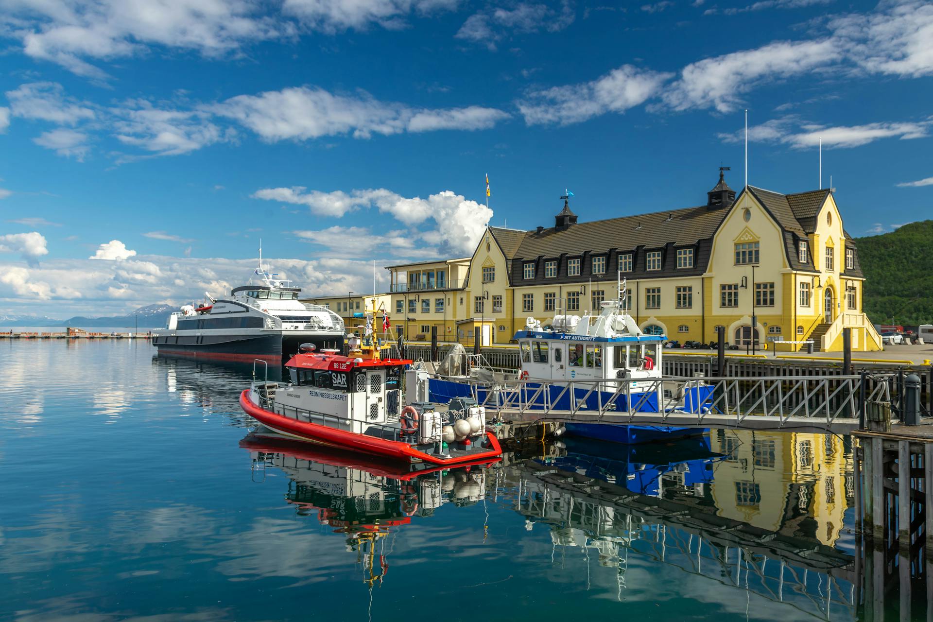 Ferry and Motorboats Moored in Harstad in Norway