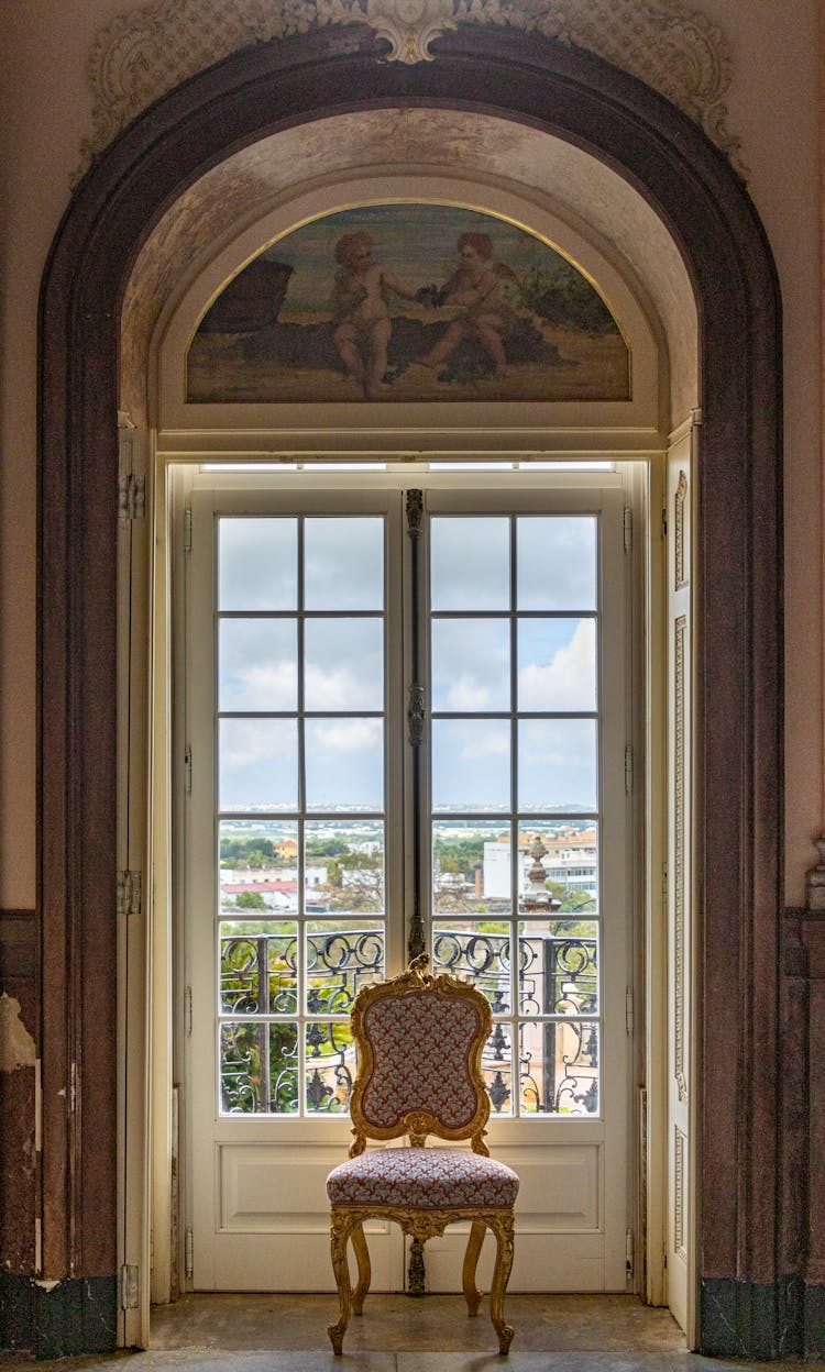 Gold And Red Chair Beside Balcony Door