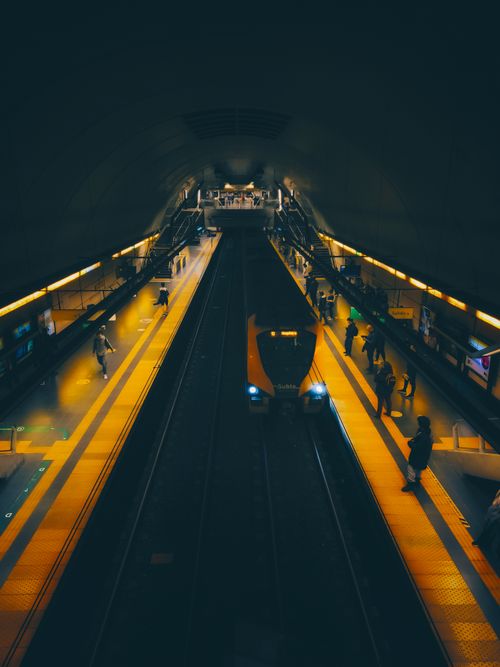 Free A dimly lit subway platform in Buenos Aires with a train approaching at night. Stock Photo