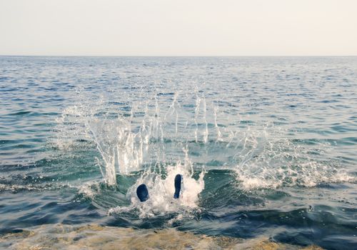 Free Dive into the vibrant Adriatic Sea with this dynamic splash scene from Pula, Croatia. Stock Photo