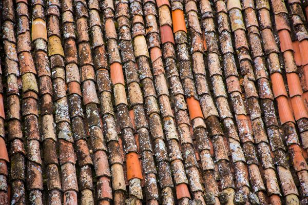 Weathered terracotta roof tiles, photo by Blaz Erzetic on Pexels