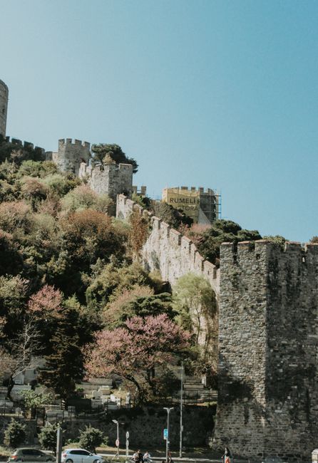 Captivating view of Rumelian Fortress and lush autumn foliage in Istanbul on a clear day.