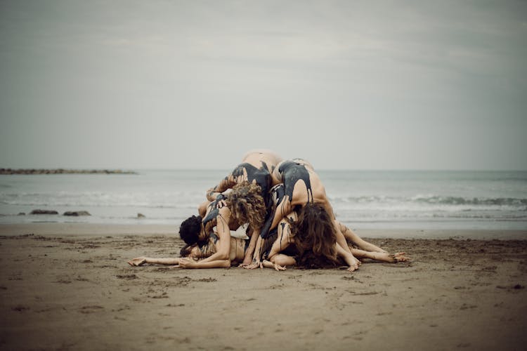 Environmental Activists During Performance On Beach Against Oil