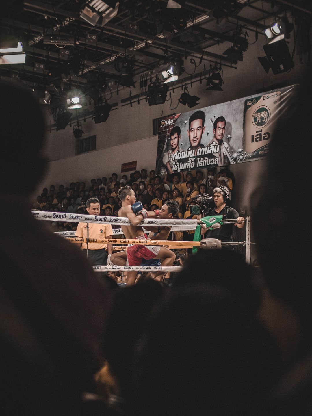 Muay Thai fighters competing during a live fight in Bangkok
