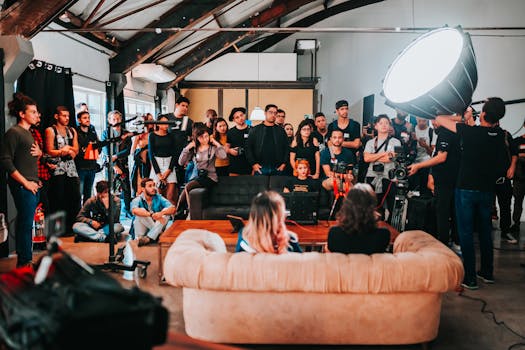 Behind-the-scenes of a photo shoot with a diverse team working together in a São Paulo studio.