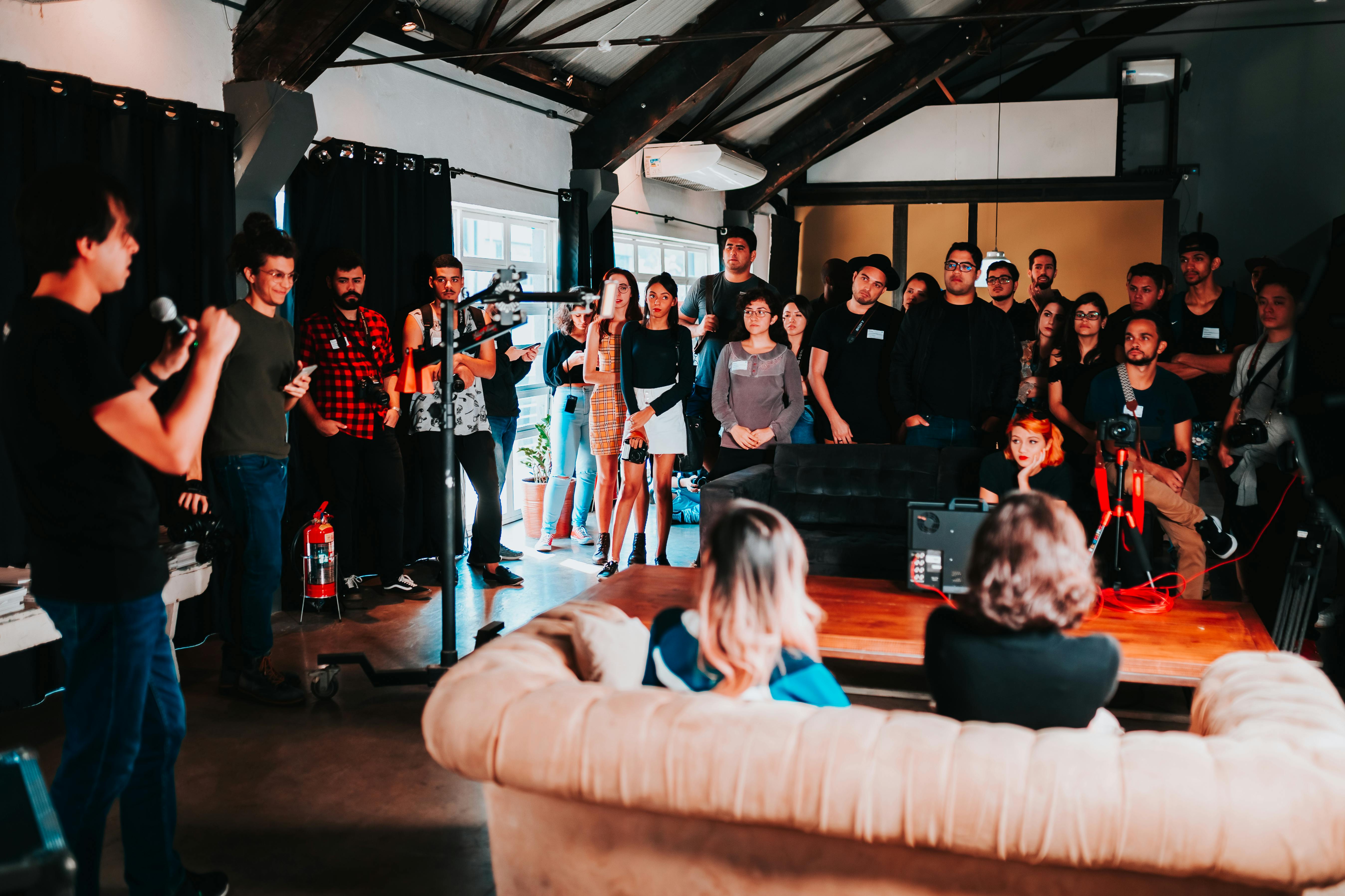 group of people standing inside room