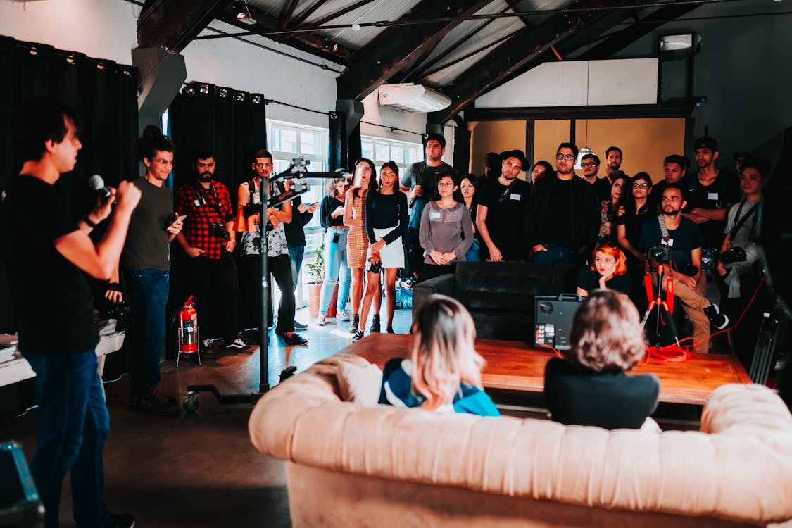 Free Group of People Standing Inside Room Stock Photo