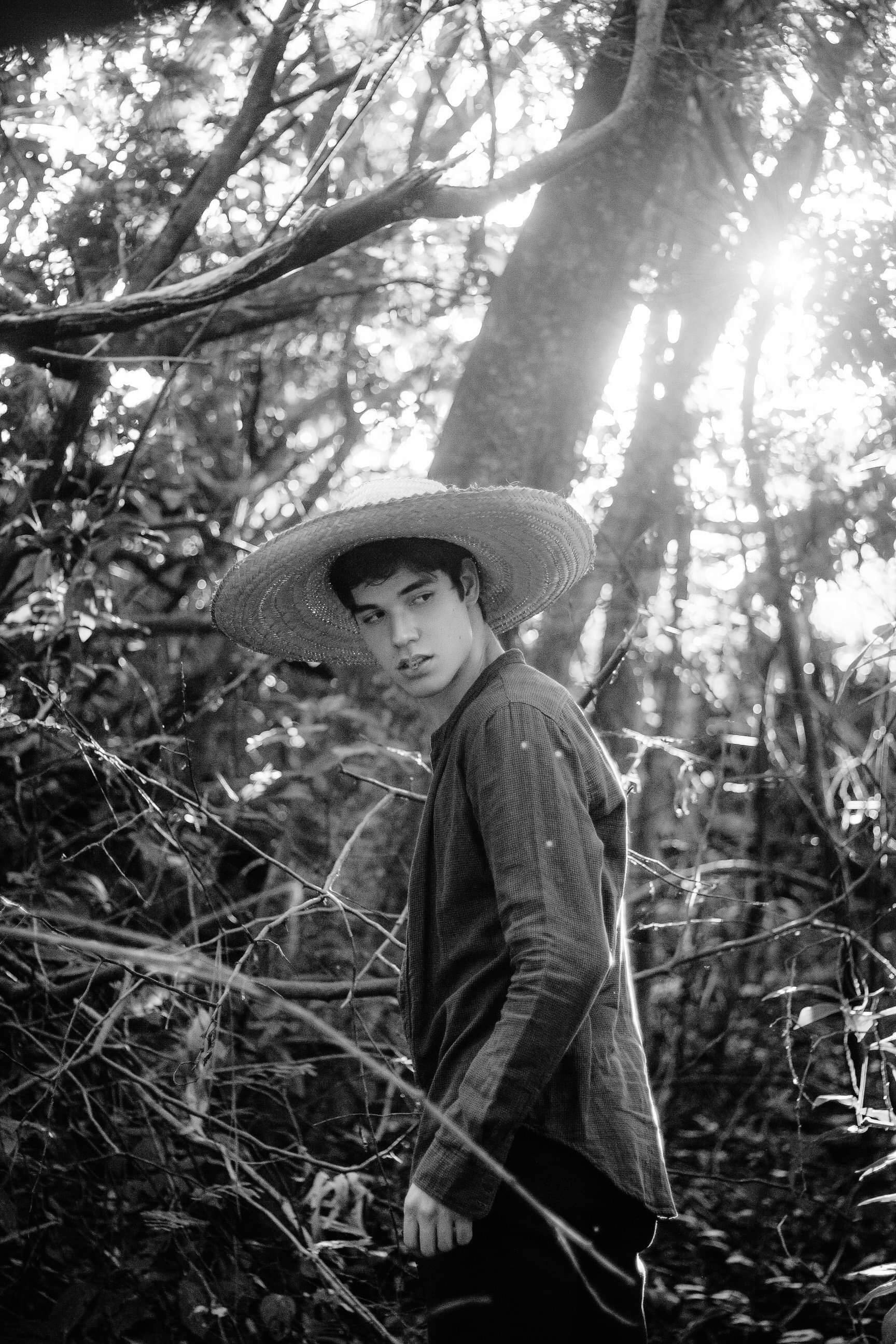 Photo of Man Standing In Front of Mango Tree with His Arms Crossed ...