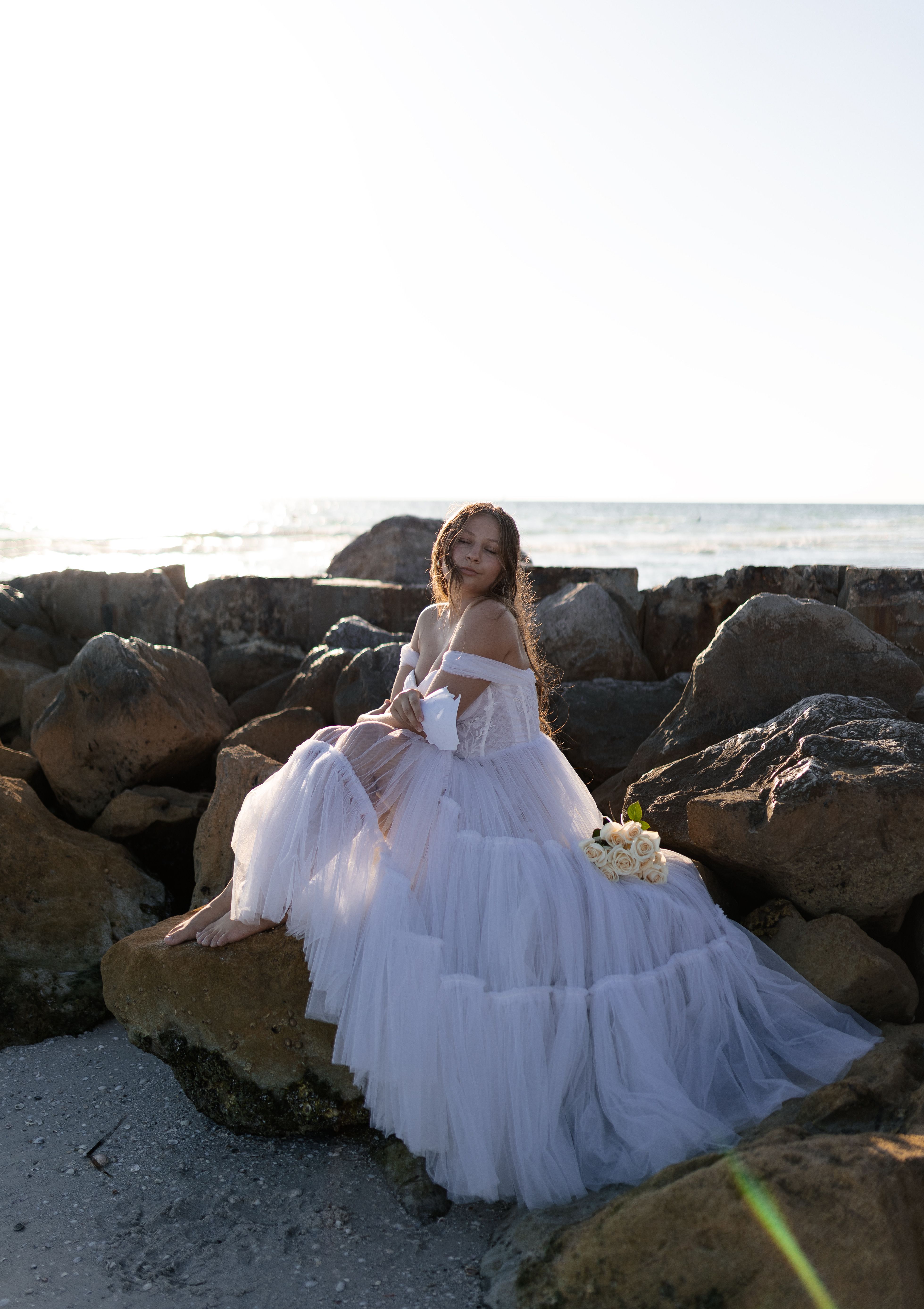 Woman In White Wedding Dress Standing On Rock · Free Stock Photo