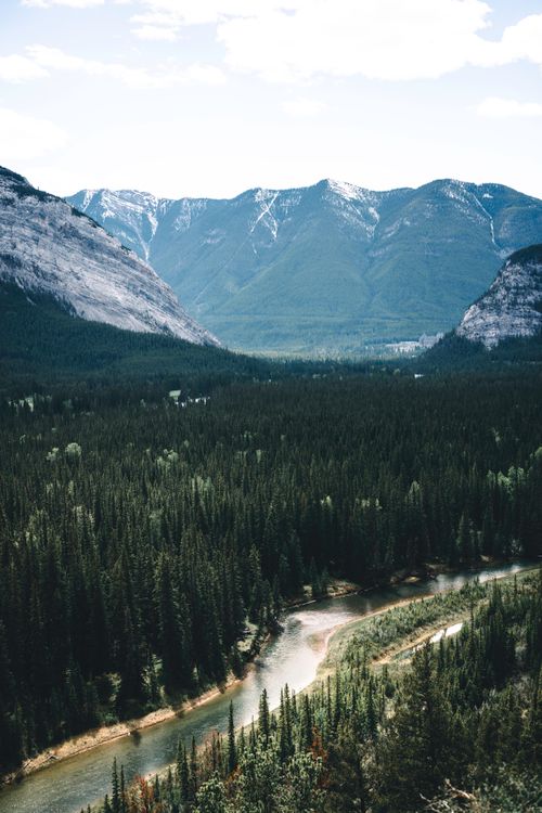 Free Breathtaking view of Banff National Park with mountains and forested river. Stock Photo