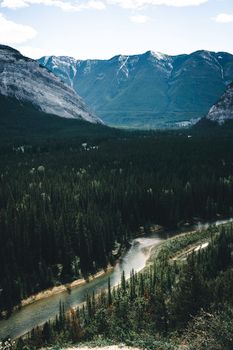 Scenic view of forested valley with river in Banff National Park, Canada.