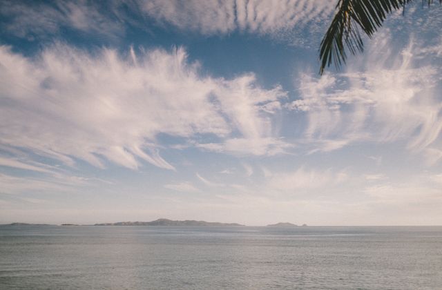 Tranquil ocean scene at Nadi, Fiji with striking clouds and gentle waves. — arriving in Nadi