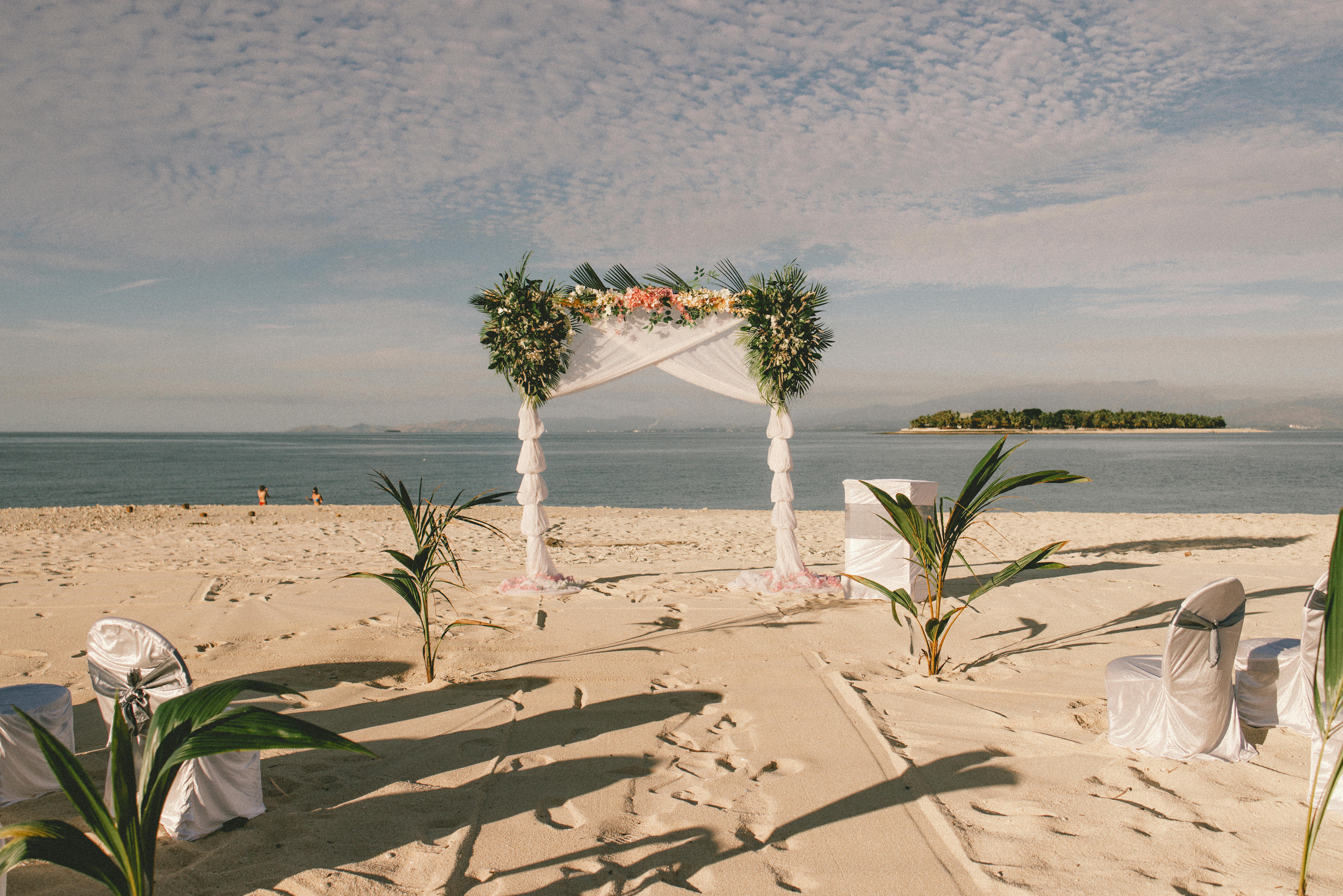 Capture the dreamy tropical beach wedding setup on Fiji's picturesque sands, perfect for travel enthusiasts.