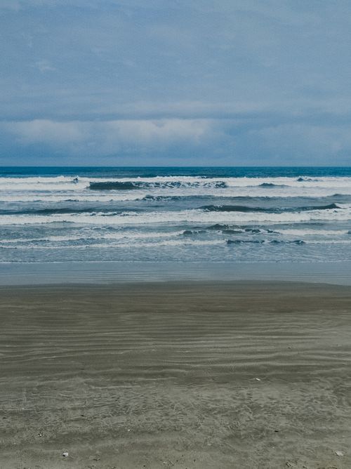 Free Tranquil depiction of Praia Grande beach in Brazil with waves and a serene atmosphere. Stock Photo